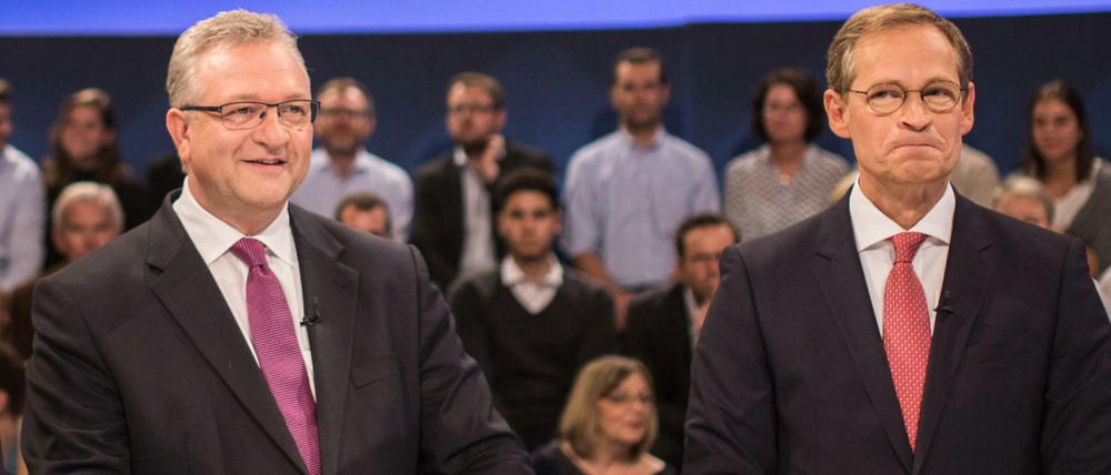 Die Spitzenkandidaten für die Berliner Abgeordnetenhauswahl Frank Henkel (CDU, l) und Michael Müller (SPD).