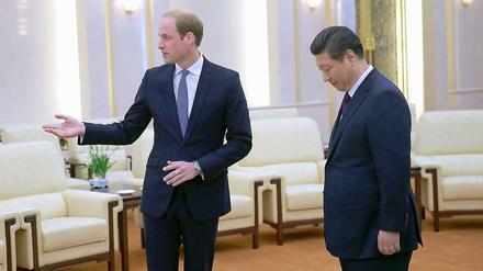Englands Prinz William (l) und der Chinesische Staats- und Parteichef Xi Jinping.