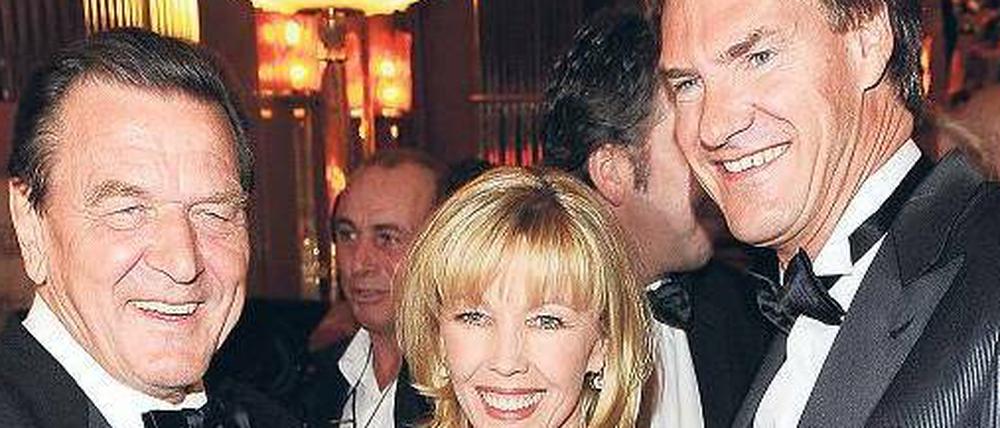 Geschäftsleute: Ehepaar Schröder und Carsten Maschmeyer.