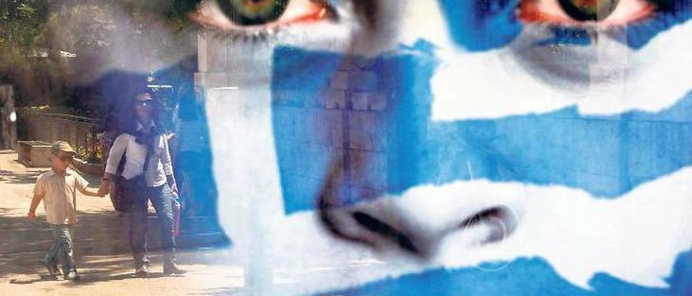 Tag der Verantwortung. Die Griechen hatten bei der Parlamentswahl am Sonntag die Entscheidung: Bestrafen sie die beiden großen Parteien „Neue Demokratie“ und Pasok für ihren Reformkurs – oder setzen sie doch auf halbwegs stabile Regierungsverhältnisse. Foto: Kostas Tsironis/AP