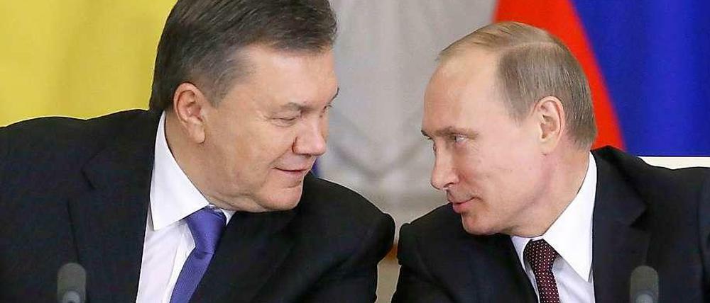 Einig. Wladimir Putin (r.) und Viktor Janukowitsch am Dienstag in Moskau.