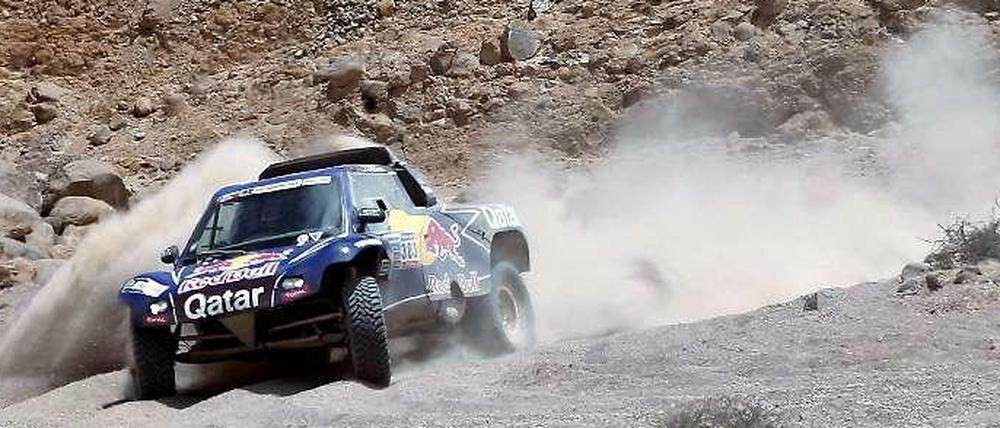 Der Buggy von Carlos Sainz und Timo Gottschalk auf der Rennstrecke in Südamerika.