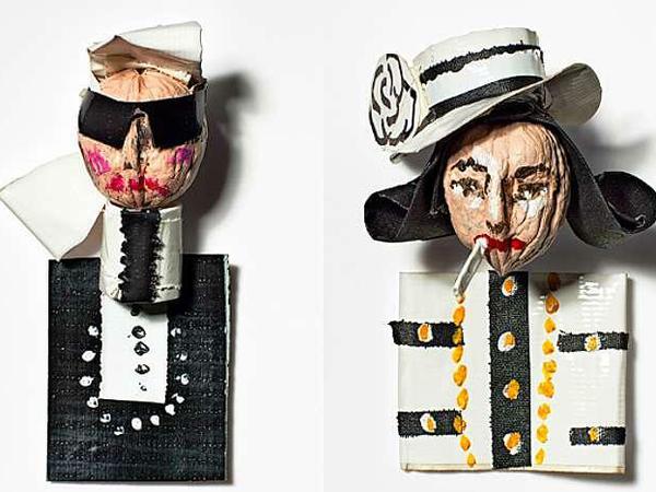 Zwei Walnüsse sind als Karl Lagerfeld und Coco Chanel verkleidet.