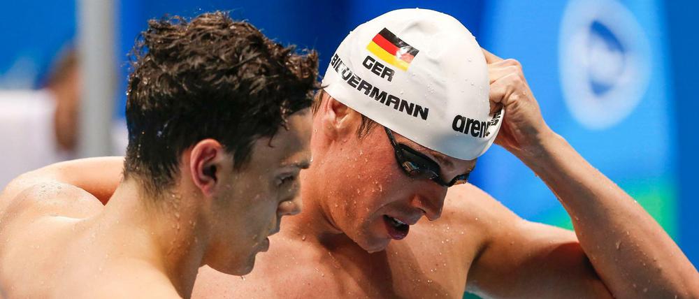 Die Badekappe für immer abgelegt: Paul Biedermann (r.) beendet seine Karriere.