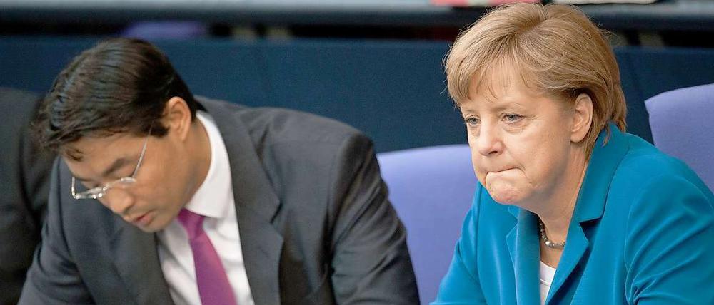 Bundeswirtschaftsminister Philipp Rösler (FDP) und Bundeskanzlerin Angela Merkel (CDU)