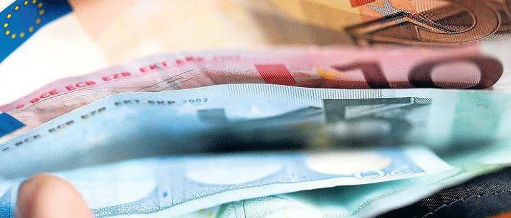 Mehr im Portemonnaie. Viele Dax-Konzerne belohnen die Beschäftigten. Foto: dapd