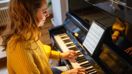 Ob Pianistin oder Streichquartett: Immer mehr Musiker spielen von Tablets statt von Papiernoten. 