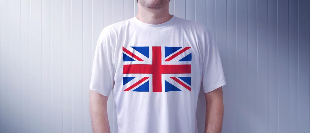 Man wearing white shirt with United Kingdom flag print, adult male person supporting Great Britain
