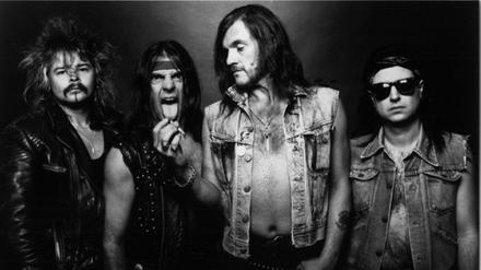 Phil Taylor (l.) mit den anderen Motörhead-Bandmitgliedern Michael Burston, Lemmy Kilminster und Phil Campbell auf einer Aufnahme von 1985.