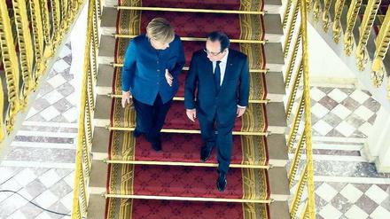 Nachbarn, Nationen. Die Kanzlerin und der Präsident im Elysée-Palast. Foto: dpa