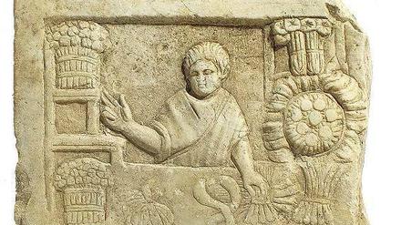 Relief aus der Hafen-Vorstadt Ostia: Ein römischer Straßenhändler verkauft Salat und Gemüse.