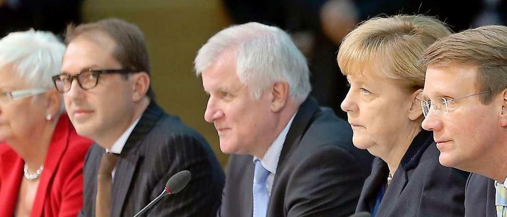 Die Union um Kanzlerin Merkel will die Arbeitswelt nach ihren Wünschen formen.