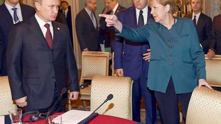 Kanzlerin Angela Merkel und Russlands Präsident Wladimir Putin in Mailand.