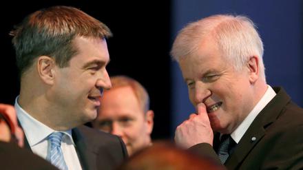 FILE PHOTO: Bavarian Prime Minister and head of the Christian Social Union (CSU) Horst Seehofer listens to Bavarian Finance Minister Markus Soeder (L) during a CSU party congress in Munich, Germany November 20, 2015. REUTERS/Michaela Rehle/File Photo