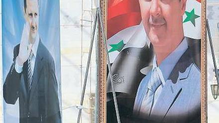 Assad-Kult: In der syrischen Hauptstadt Damaskus ist der Staatschef Baschar al Assad auf unzähligen überlebensgroßen Wahlplakaten präsent. Foto: Joseph Eid/AFP
