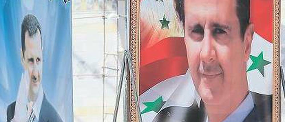 Assad-Kult: In der syrischen Hauptstadt Damaskus ist der Staatschef Baschar al Assad auf unzähligen überlebensgroßen Wahlplakaten präsent. Foto: Joseph Eid/AFP