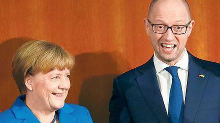 Gemeinsam eröffneten Kanzlerin Angela Merkel und der ukrainische Regierungschef Arseni Jazenjuk ein Wirtschaftsforum in Berlin.