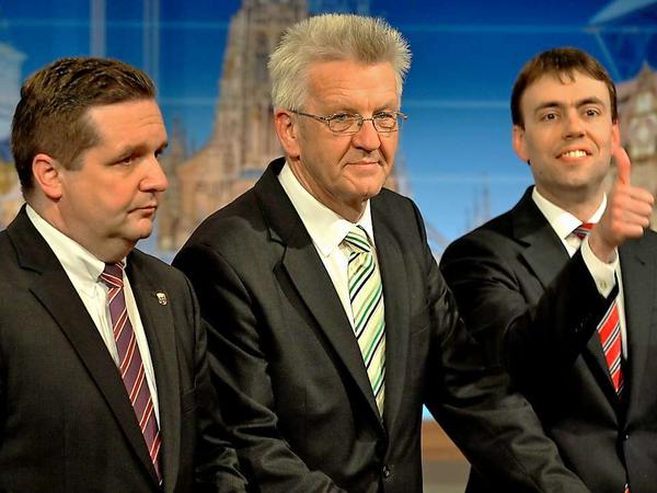 Der Sieger steht (vorerst) fest: Das vorläufige Endergebnis sieht Winfried Kretschmann (Mitte) vorn. Auch Nils Schmid kann sich freuen: Seine SPD darf als Juniorpartner mitregieren.