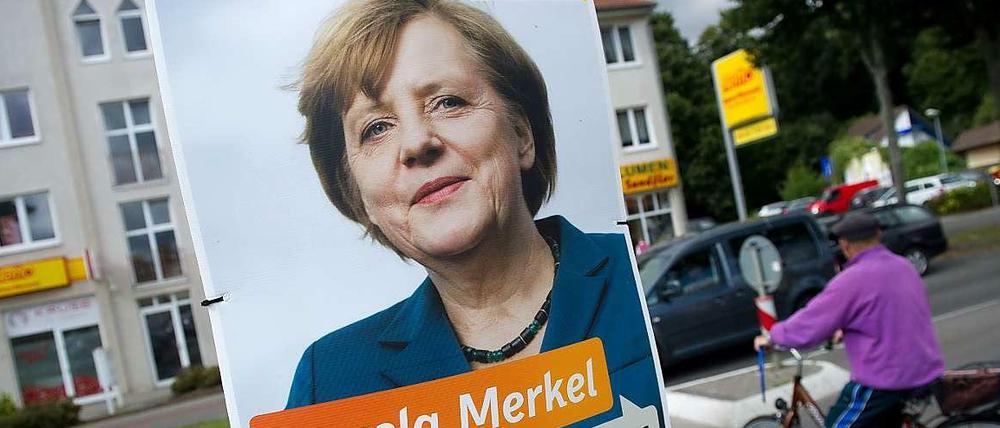 Angela Merkel auf einem Wahlplakat.