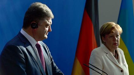 Gemeinsam für Besserung der Lage in der Ukraine? Petro Poroschenko (l.) und Angela Merkel.