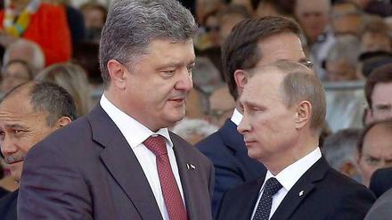 Nach Angaben des Kreml haben Poroschenko und Putin Gespräche über eine Waffenruhe begonnen.