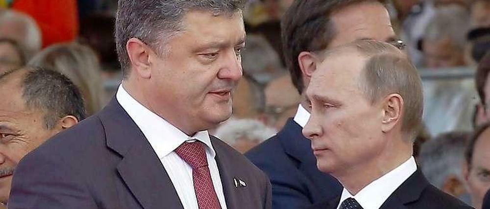 Nach Angaben des Kreml haben Poroschenko und Putin Gespräche über eine Waffenruhe begonnen.