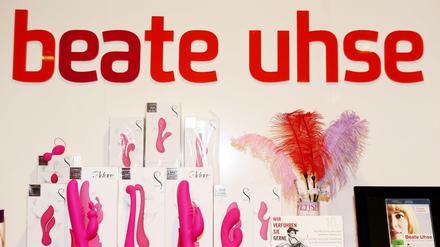 A picture taken on July 23, 2013 in Flensburg shows sex toys displayed on shelves at a shop of the pioneering German sex shop chain Beate Uhse. The pioneering Germ