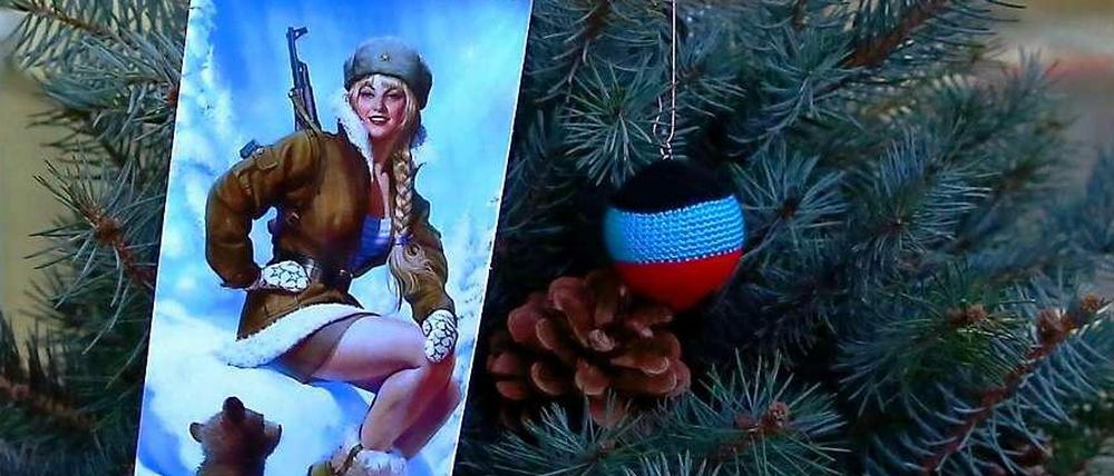 „Frohes neues Jahr, Noworossija!“ Diese Postkarte auf einem Markt in Donezk stimmt auf 2015 ein. Die Gefechte in der Region dauern weiter an. 