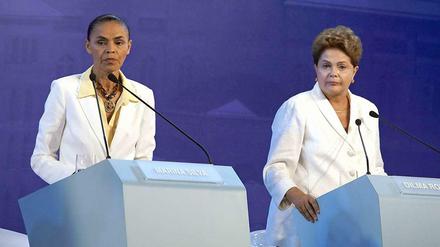 Die einen wollen viele Brasilianer loswerden (Dilma Rousseff, r.), die andere wollen viele aber nicht haben (Marina Silva, l.). 