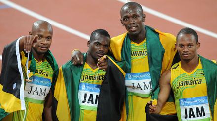 Da feierten sie noch. Asafa Powell, Nesta Carter, Usain Bolt und Michael Frater müssen ihr Staffel-Gold von Peking zurückgeben. 