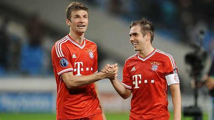 Grund zur Freude schon vor der WM. Thomas Müller (l.) und Philipp Lahm bleiben noch jahrelang beim FC Bayern München.
