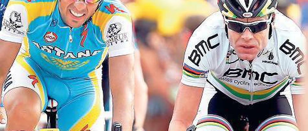 An der Seite der Stars. So sieht sich Cadel Evans (rechts neben dem zweimaligen Tour-Sieger Alberto Contador). Dass er nicht als Spitzenfahrer und Favorit auf den Gesamtsieg wahrgenommen wird, ärgert den Australier gewaltig. Foto: dpa