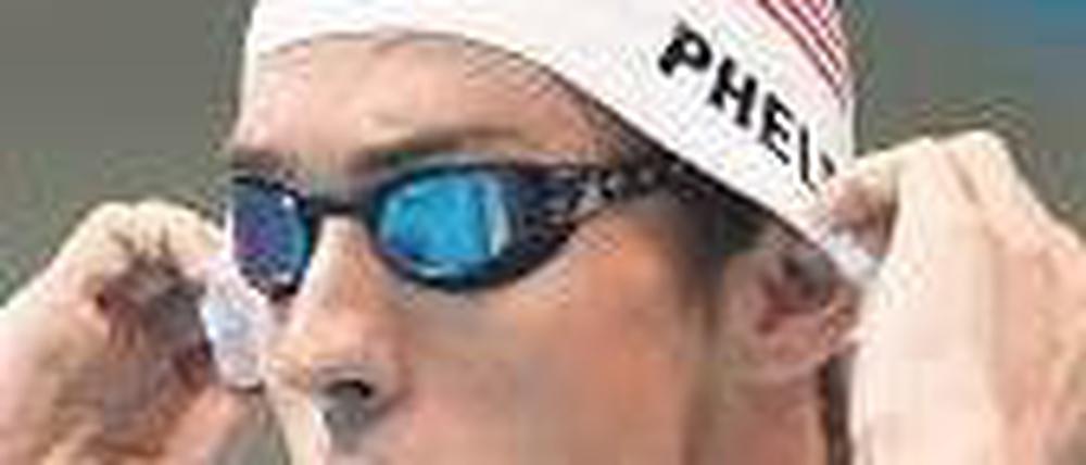Ein Diener seines Landes. Michael Phelps weiß, was er den USA schuldig ist. Das kommt daheim gut an. Foto: AFP