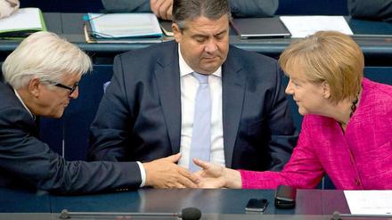 Bundeskanzlerin Angela Merkel und ihre SPD-Minister Sigmar Gabriel und Frank-Walter Steinmeier.