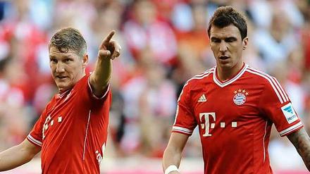 Beide nicht dabei: Bayern München muss bzw. will im Pokalfinale ohne Bastian Schweinsteiger (l.) und Mario Mandzukic auskommen. 