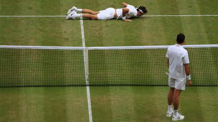 Milos Raonic sah Roger Federer fallen.
