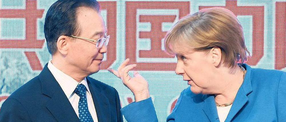 Wer gibt hier den Ton an? Chinas Ministerpräsident Wen Jiabao und Bundeskanzlerin Angela Merkel eröffneten die Hannover Messe. Foto: dpa