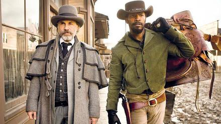 Bei der Arbeit: Im Western „Django Unchained“ suchen die Kopfgeldjäger Christoph Waltz und Jamie Foxx nach Einnahmequellen. 