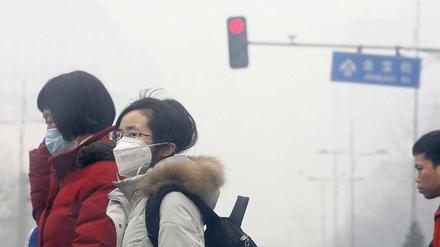 Trübe Aussichten. Die Pekinger Luft trägt zu Atemwegserkrankungen bei.