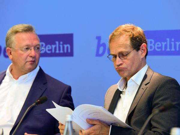 Berlins Regierender Bürgermeister Michael Müller (r, SPD) und Innensenator Frank Henkel (CDU) hätten viel zu besprechen - die Stimmung aber ist unter dem Gefrierpunkt.