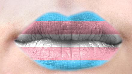 Female lips close up with a picture flag of Transgender. 