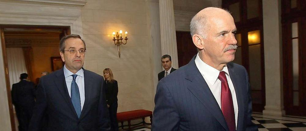 Verpflichten sich zu den Reformen: Giorgos Papandreou (vorn) und Antonis Samaras.