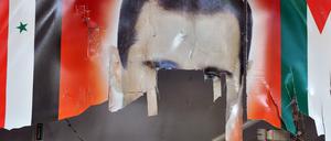 Ein zerrissenes Poster des syrischen Präsidenten Bachar al-Assad in der Stadt of Ras al-Ain im Norden Syriens.