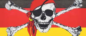 Vaterlandsverräter. Wenn deutsche Fans die deutsche Fahne schwenken, dann widmen die Piraten Schwarz-Rot-Gold zum Piratenwimpel um. Foto: imago