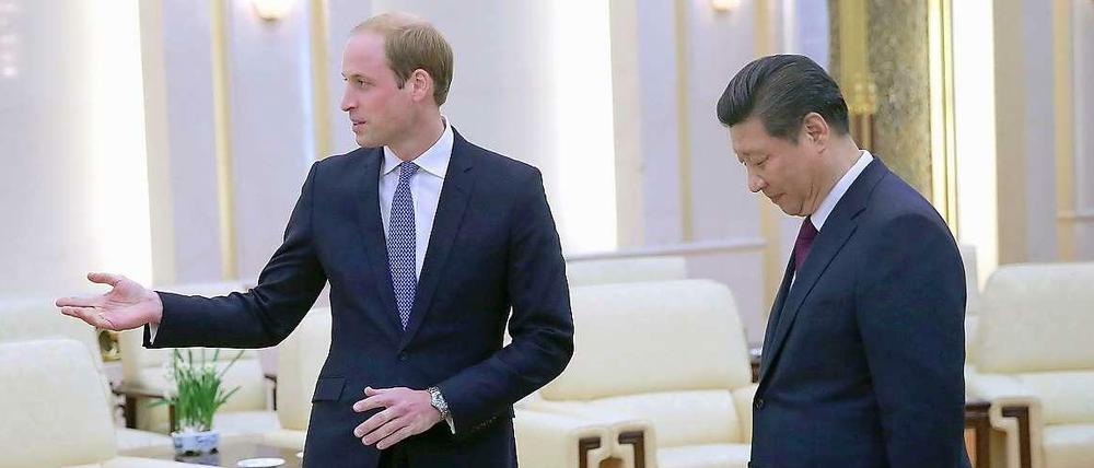Englands Prinz William (l) und der Chinesische Staats- und Parteichef Xi Jinping.