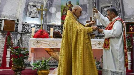 Im Irak feiern Christen die Messe am Weihnachtsmorgen. Das Fest ist nun auch ein gesetzlicher Feiertag.