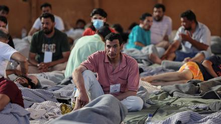 Migrants rest in a shelter, following a rescue operation, after their boat capsized in the open sea,  in Kalamata, Greece, June 14, 2023. REUTERS/Stelios Misinas