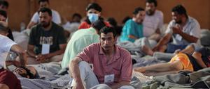 Migrants rest in a shelter, following a rescue operation, after their boat capsized in the open sea,  in Kalamata, Greece, June 14, 2023. REUTERS/Stelios Misinas