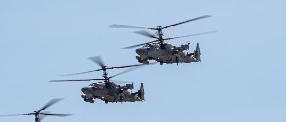 Russia, Khabarovsk - May 7, 2020: Parade in honor of victory Military air parade in honor of Victory Day. K-52 helicopters alligator fly in formation. xkwx air, aircraft, aviation, attack, helicopter, military, blue, may, victory, army, airshow, sky, flight, group, alligator, celebration, force, 2015, blade, anniversary, celebrate, assault, parade, air force, blue sky, airplane, airport, content, engine, exhibition, festival, fighting, fly, over, 2013, aeroplane, base, clear, cockpit, demonstration, exhibit, part, square, armed, armor, battle, business, camouflage, chopper, clouds
