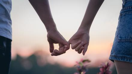 Couple in love holding hearts.